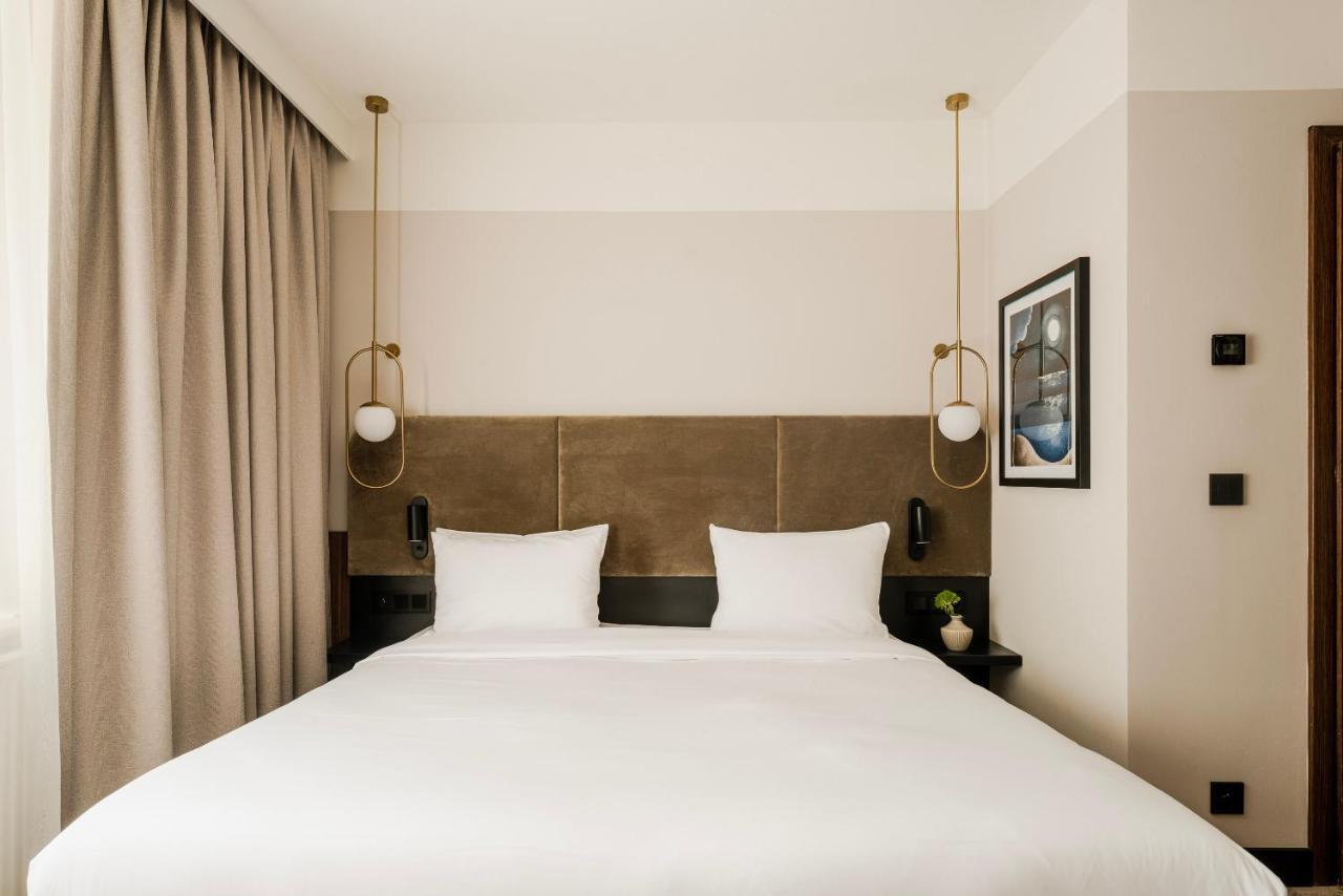 Royal Tulip Sand Kołobrzeg Kültér fotó A bedroom at the hotel