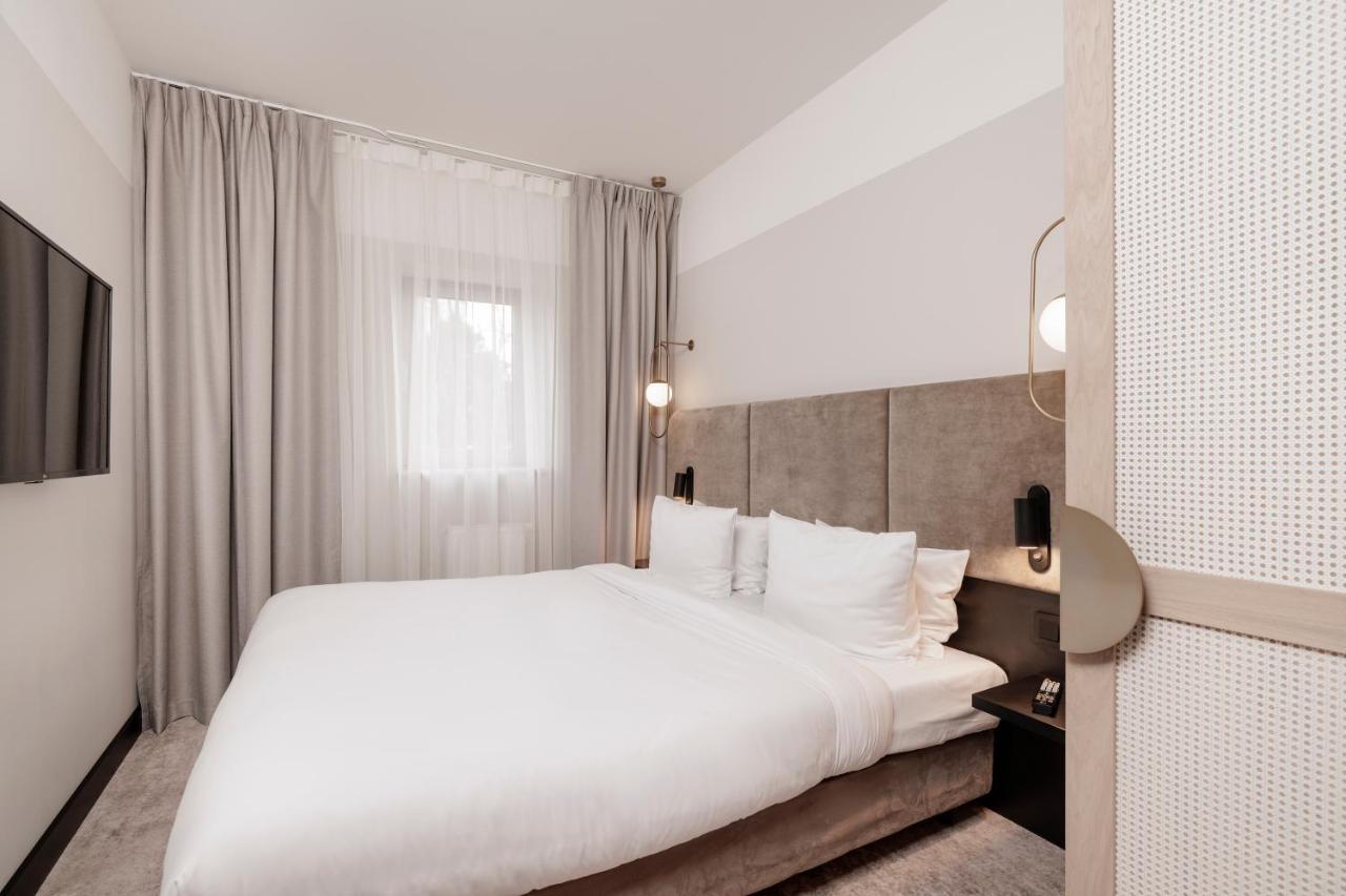Royal Tulip Sand Kołobrzeg Kültér fotó A bedroom at the hotel